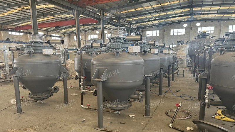 Upward blowing pneumatic ash conveying bin pump